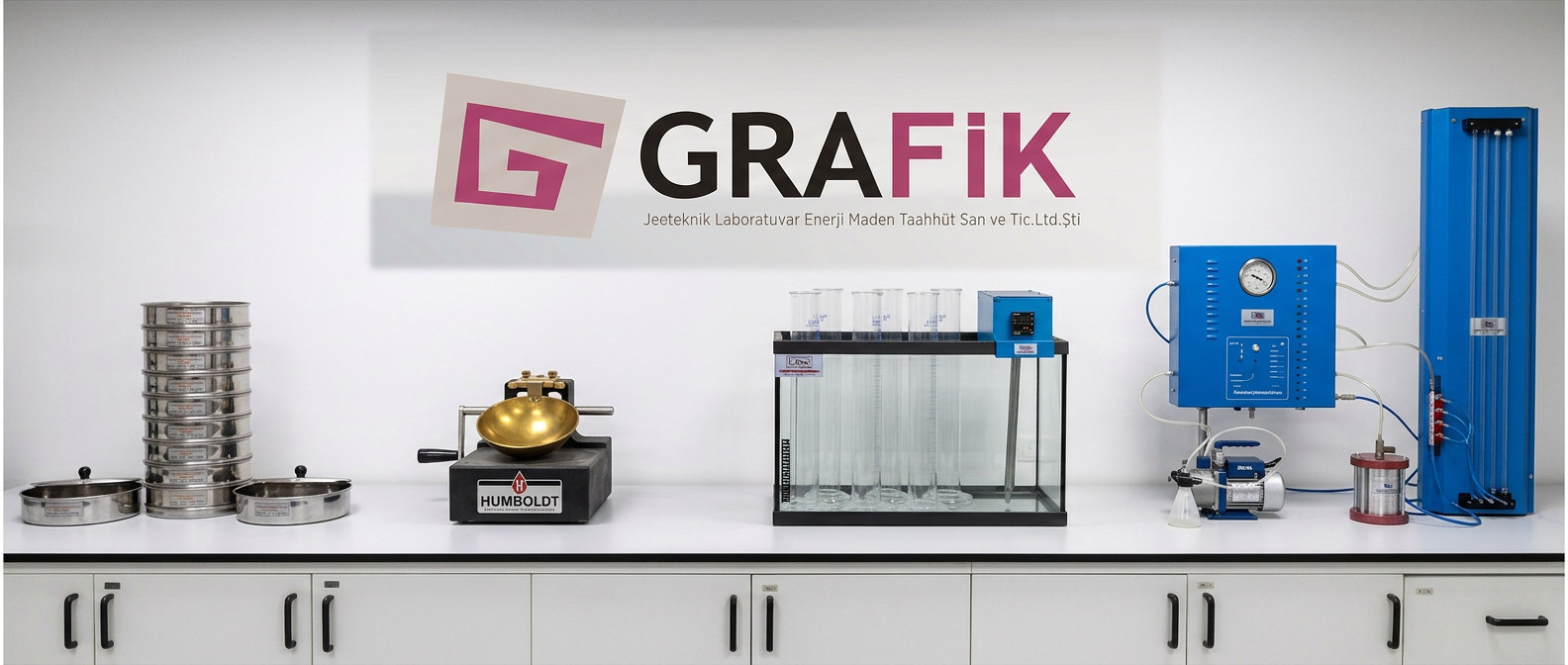 Grafik Jeoteknik laboratory — technicians working with triaxial, direct shear and rock testing equipment