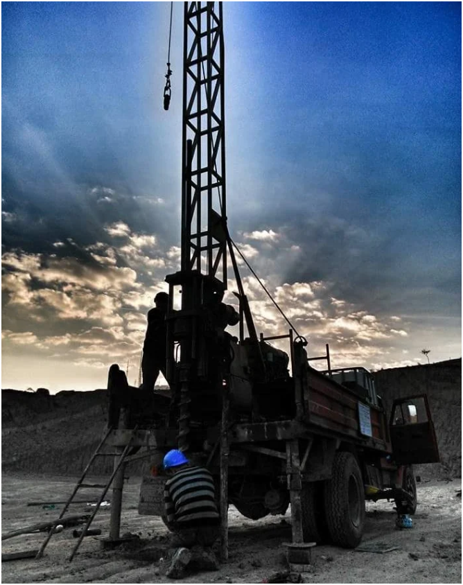 Drilling rig silhouette at sunset